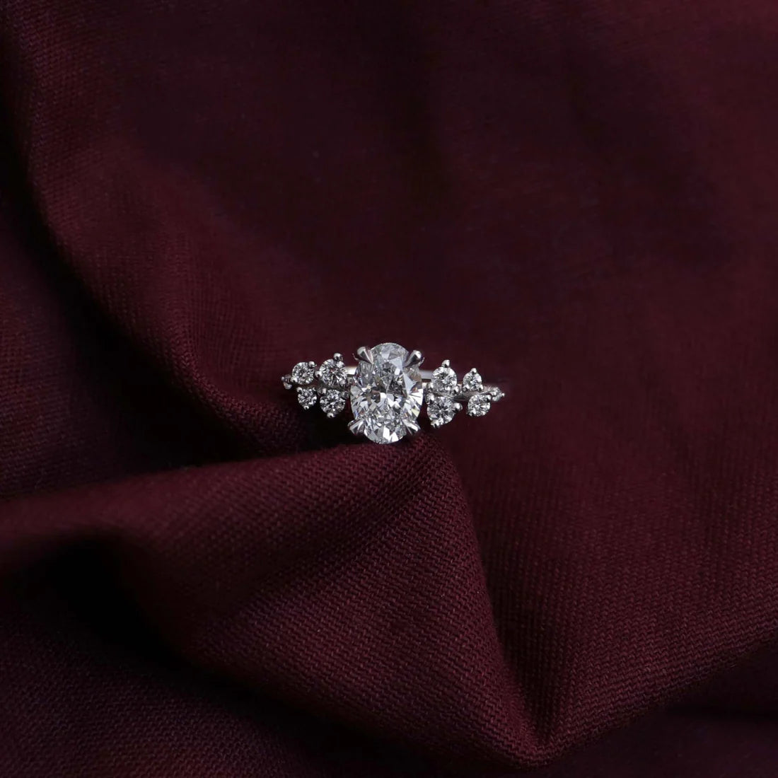 Oval Lab-Grown Diamond Solitaire Engagement Ring with Cluster Diamond Shoulders