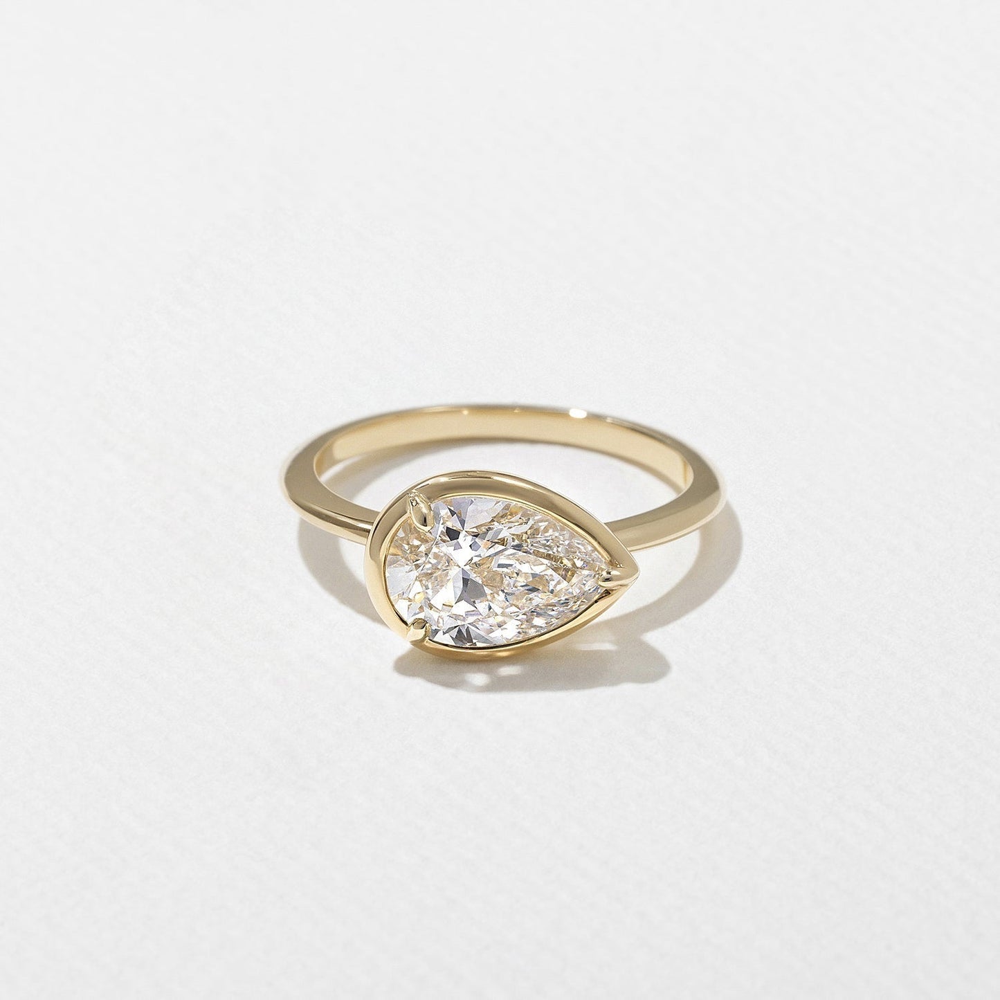 East-West Pear Lab Grown Diamond Bezel Solitaire Engagement Ring