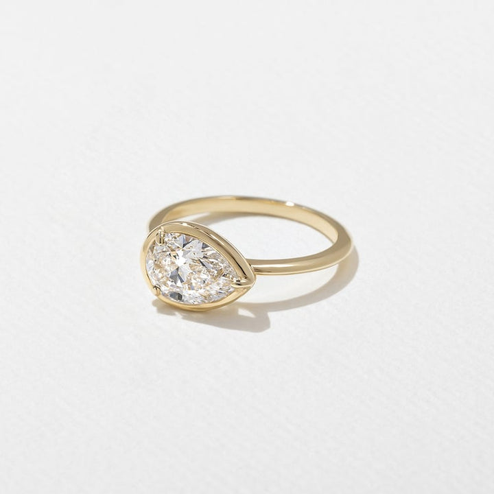 East-West Pear Lab Grown Diamond Bezel Solitaire Engagement Ring