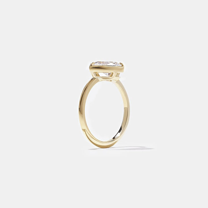 East-West Pear Lab Grown Diamond Bezel Solitaire Engagement Ring