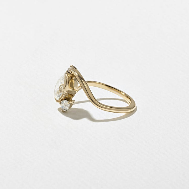 Oval Lab Grown Diamond Bypass Engagement Ring with Pear Accent Stones