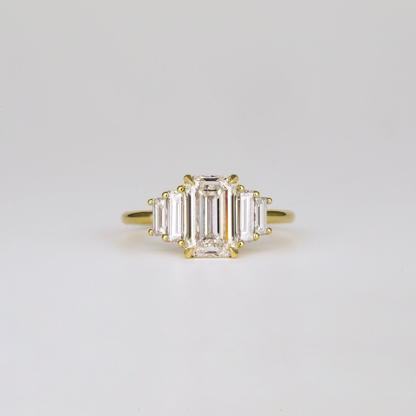 Five Stone Emerald Lab Diamond Graduated Gold Ring