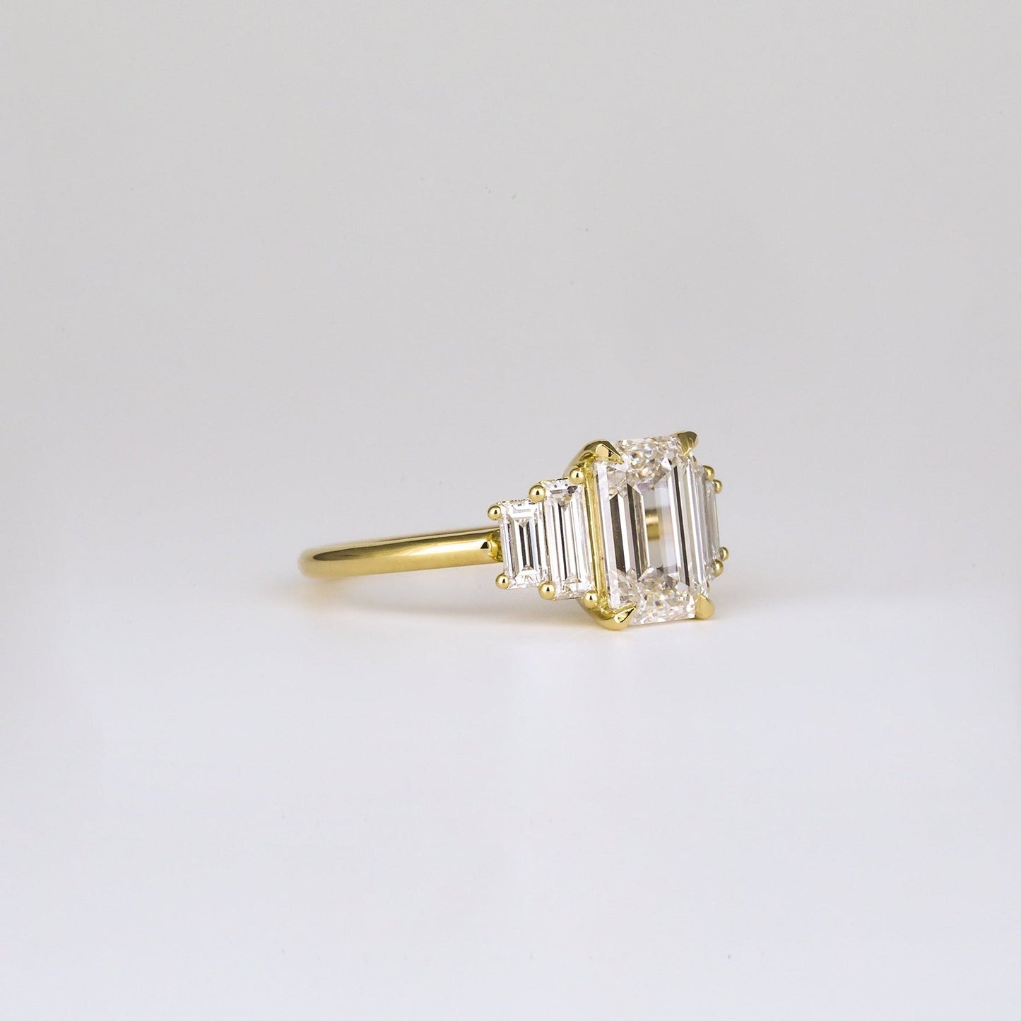 Five Stone Emerald Lab Diamond Graduated Gold Ring