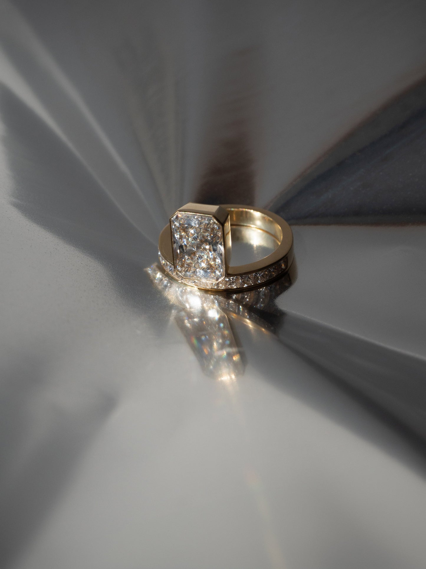 Radiant Cut Lab Grown Diamond Bezel Engagement Ring with Princess Channel Band
