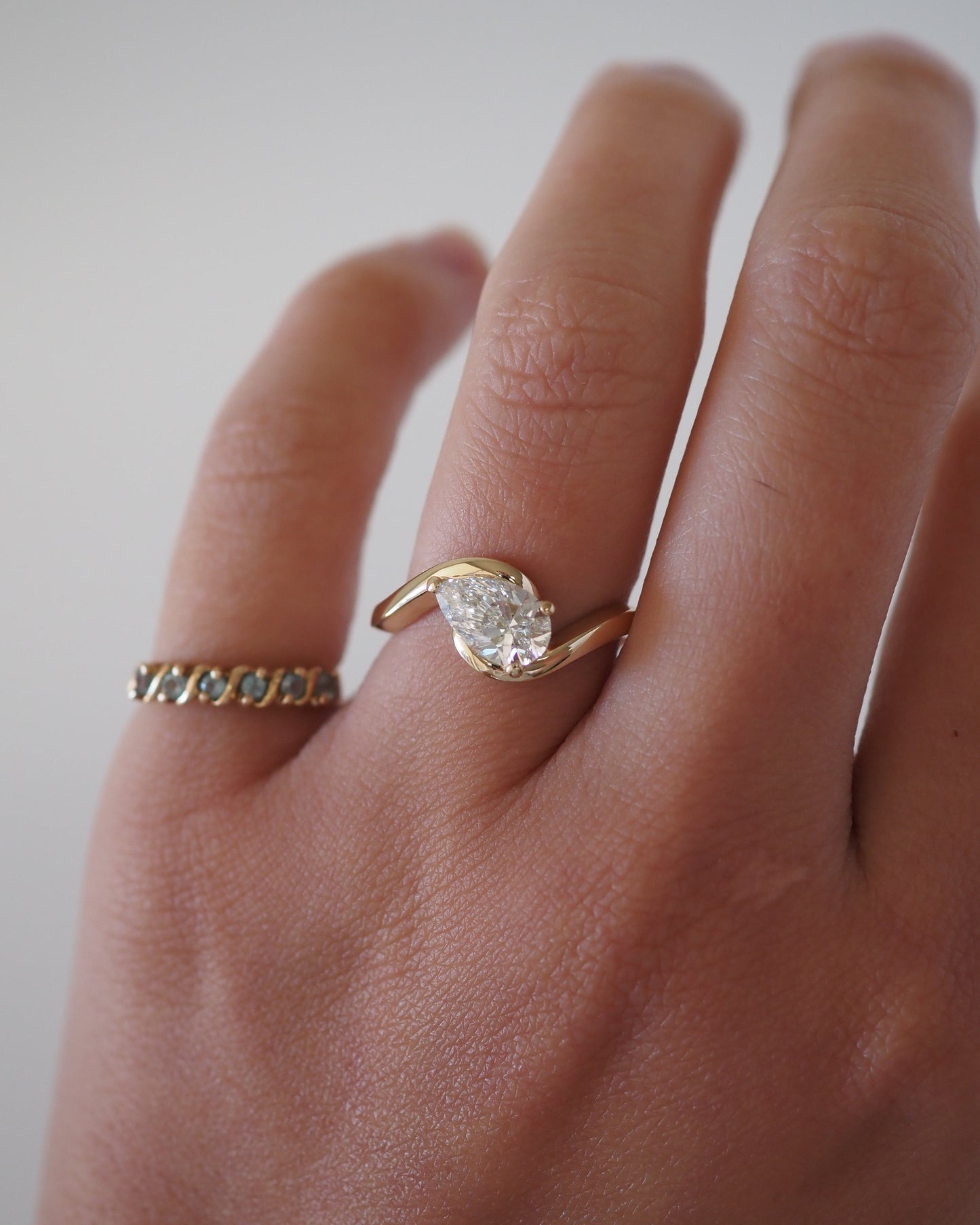 East-West Pear Lab Grown Diamond Half-Bezel Bypass Solitaire Engagement Ring