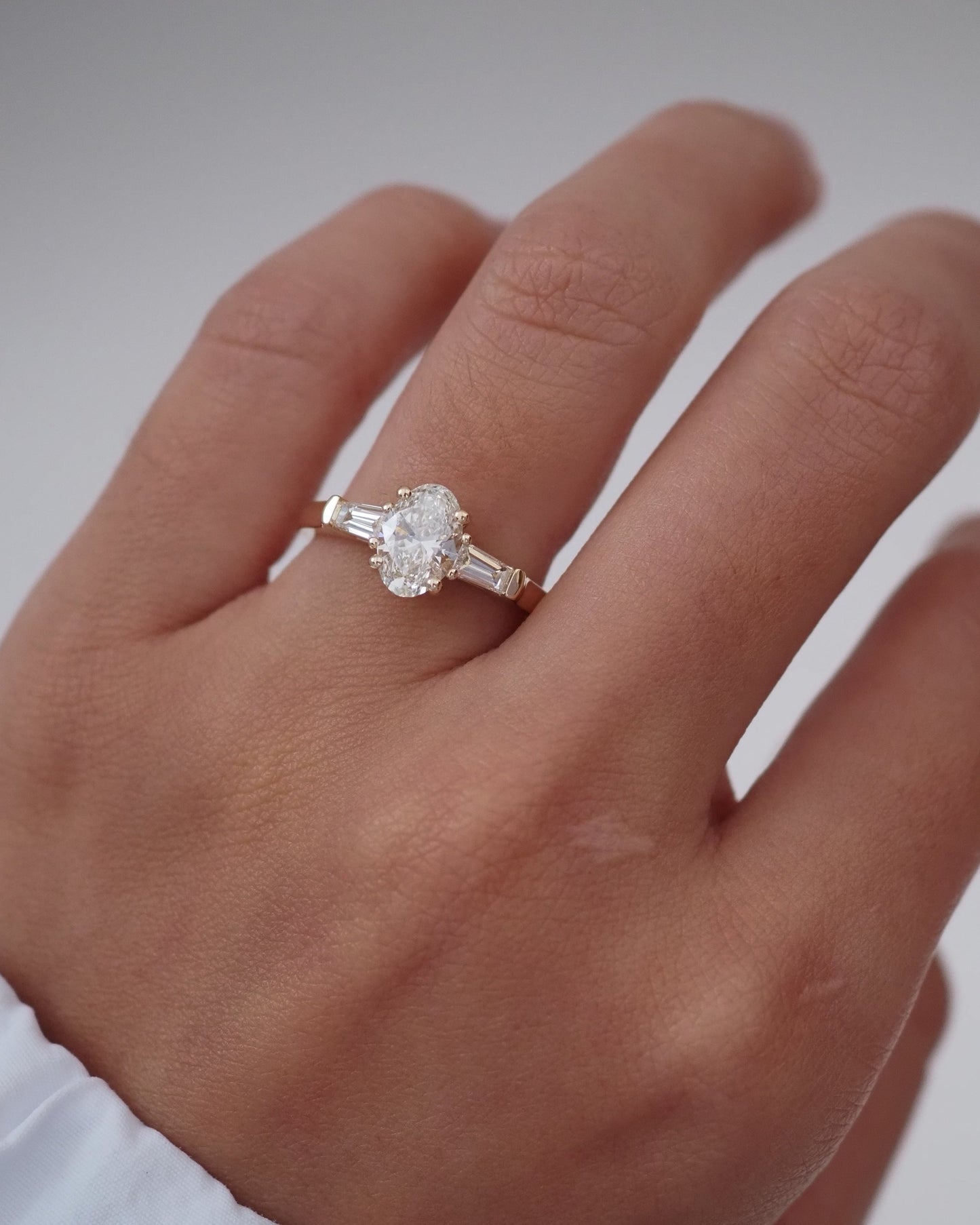 Oval Lab Diamond Three Stone Ring with Baguette Accents