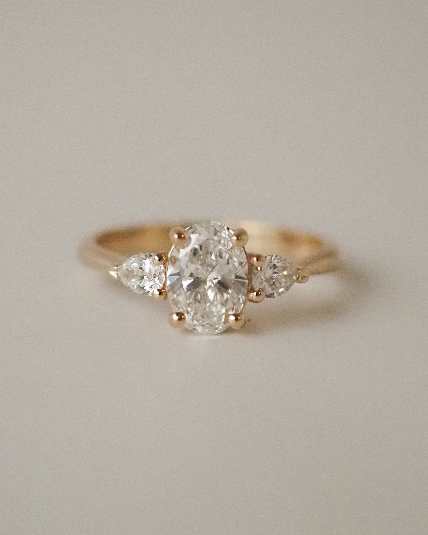 Oval Lab Diamond Three Stone Ring with Pear Accents