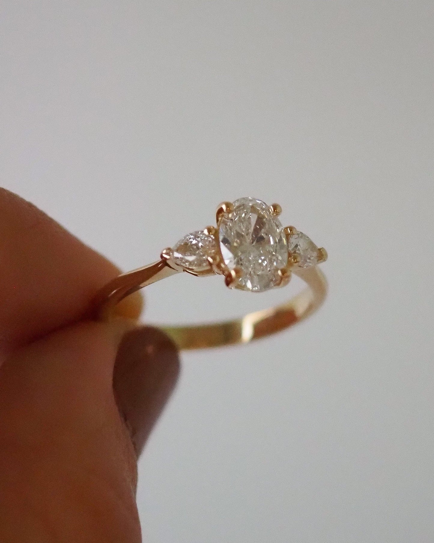 Oval Lab Diamond Three Stone Ring with Pear Accents
