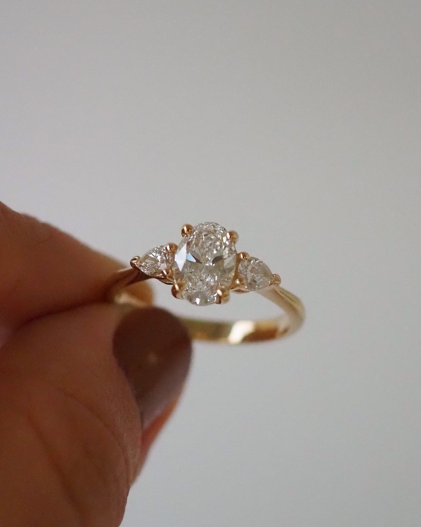 Oval Lab Diamond Three Stone Ring with Pear Accents