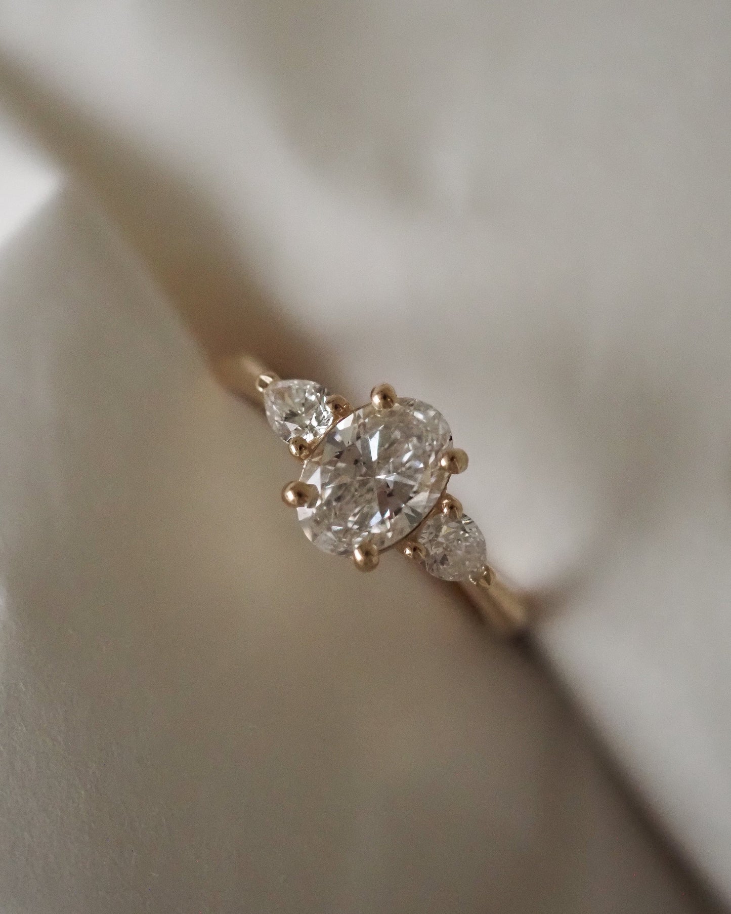 Oval Lab Diamond Three Stone Ring with Pear Accents