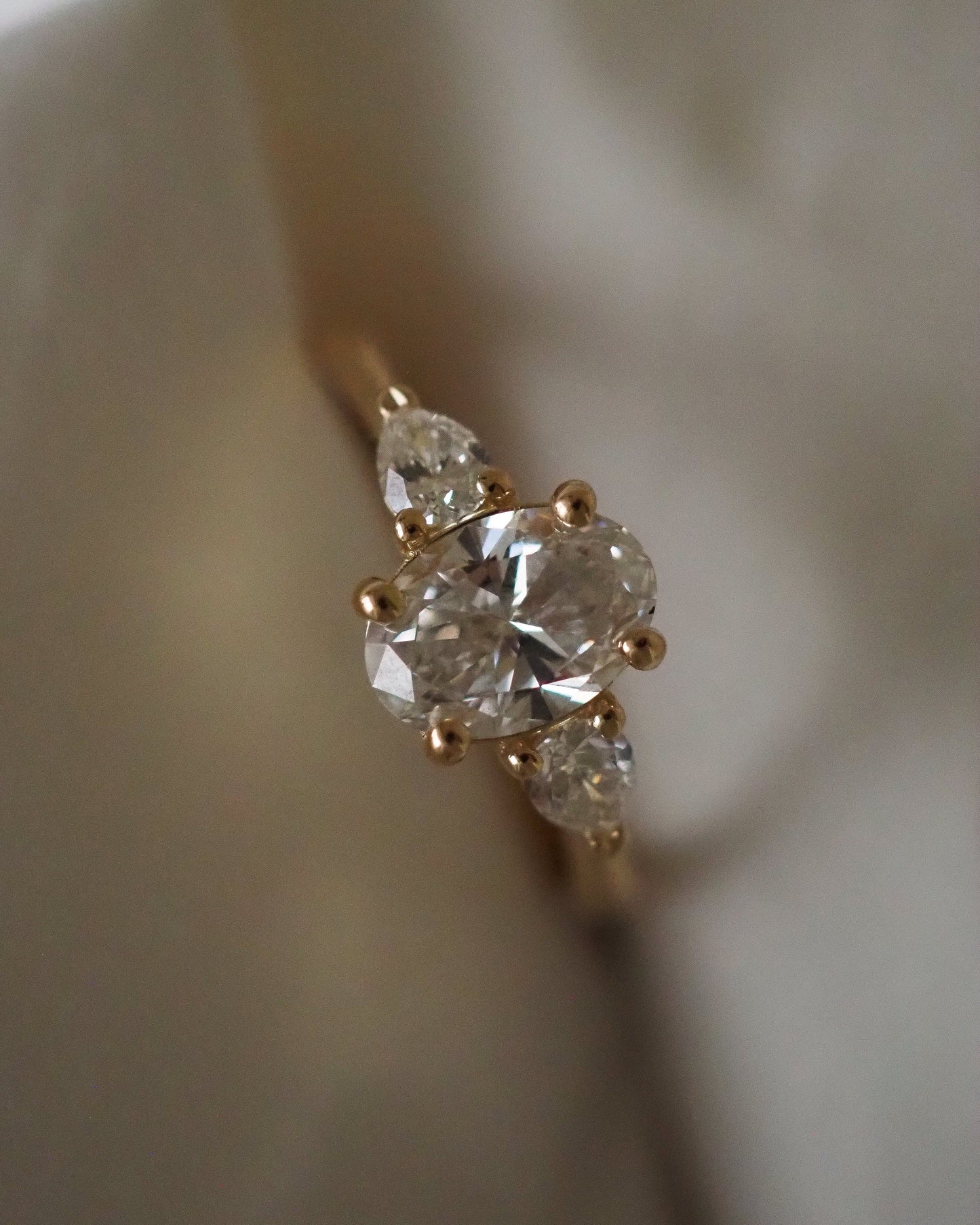 Oval Lab Diamond Three Stone Ring with Pear Accents