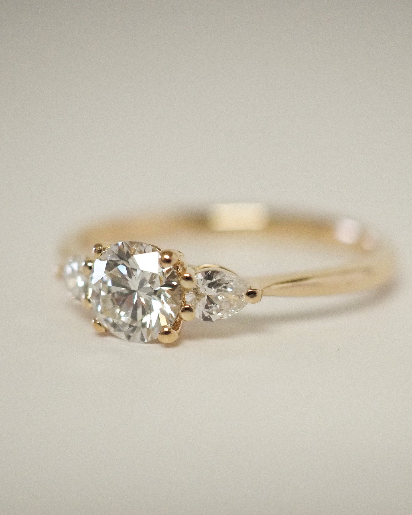 Round Lab Diamond Three Stone Ring with Pear Accents