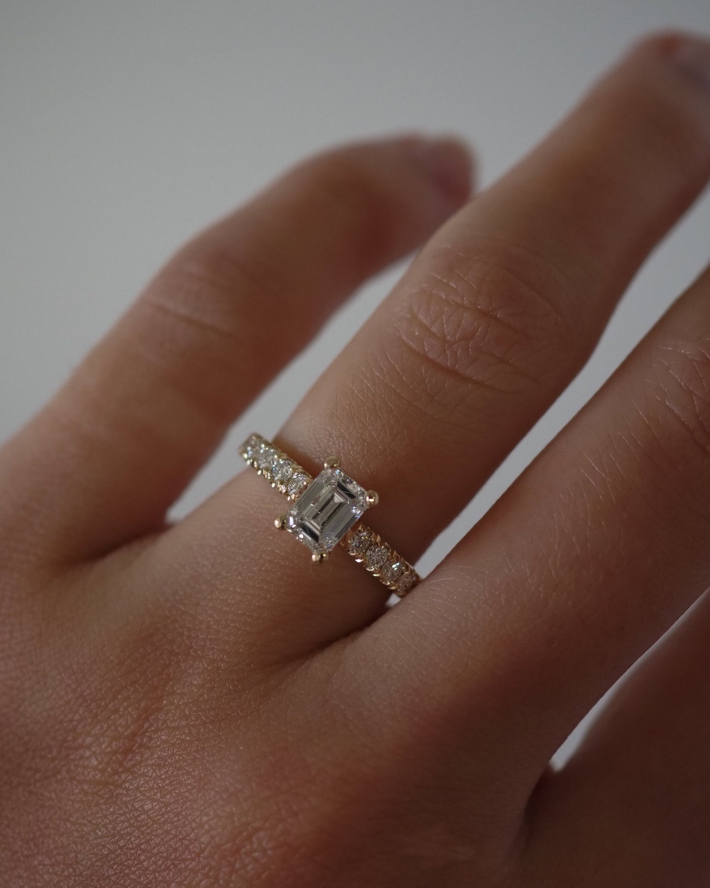 Emerald Lab Diamond Solitaire Ring with Pavé Band
