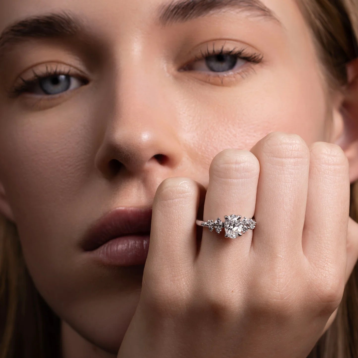 Oval Lab-Grown Diamond Solitaire Engagement Ring with Cluster Diamond Shoulders